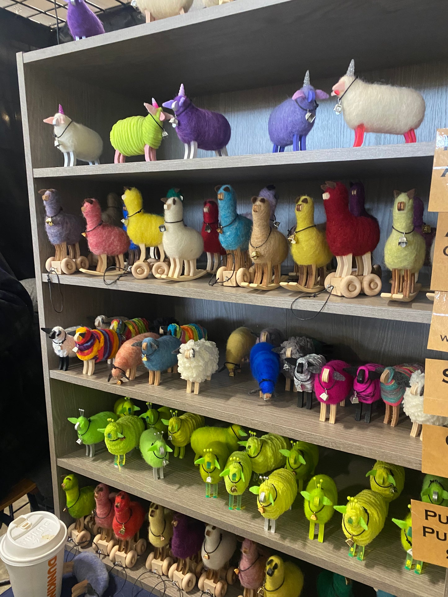 Shelf with colorful toy animals on a store shelf